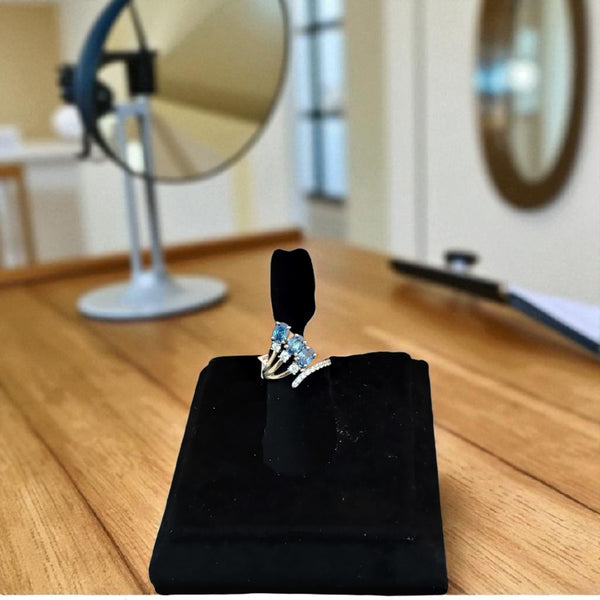 Silver ring with three blue stone